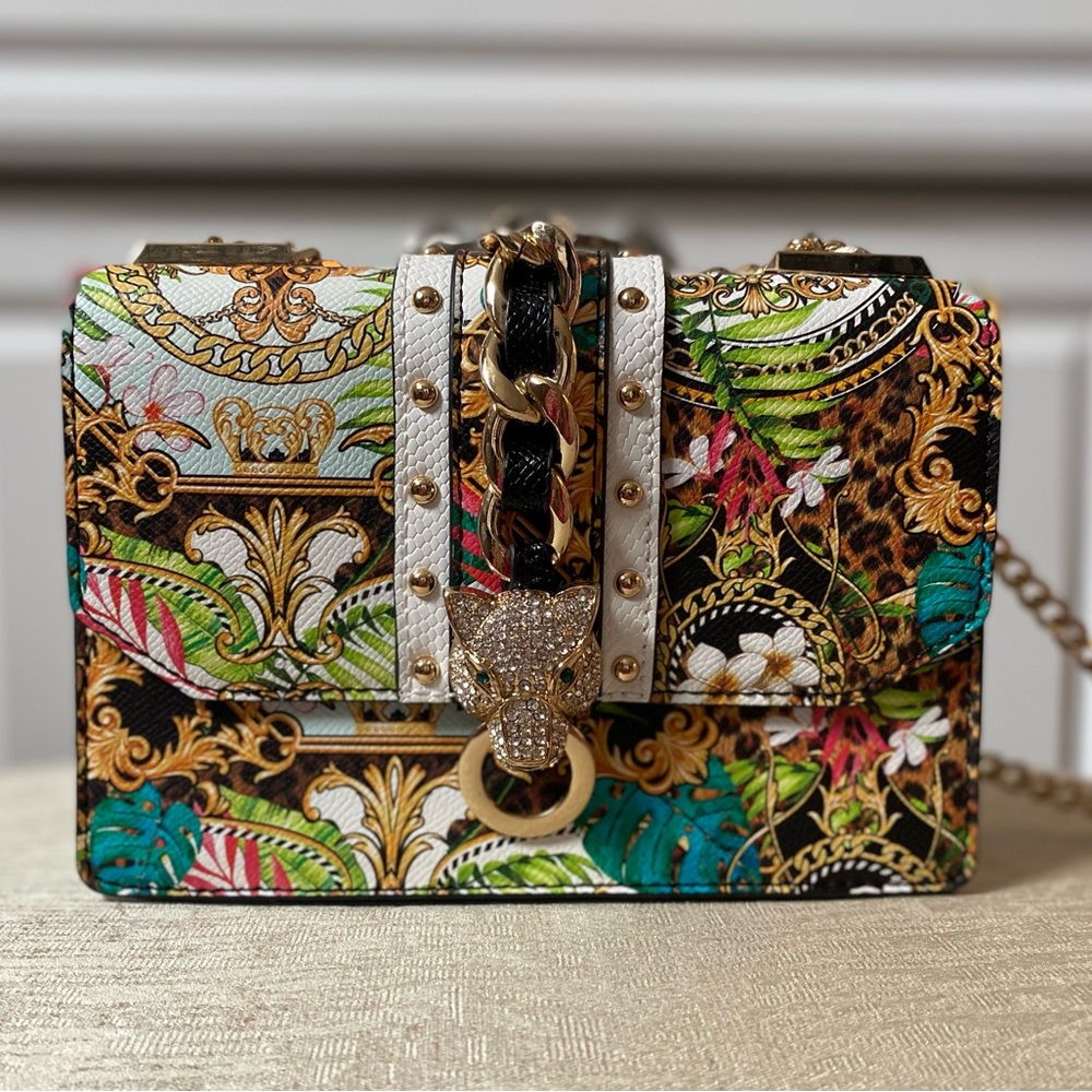 Small unique handbag with a jungle vibe.  Purchased at upscale boutique.